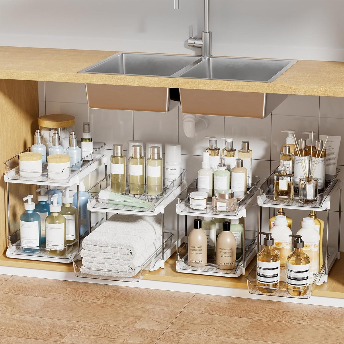 Four pull-out organizers arranged under a kitchen sink