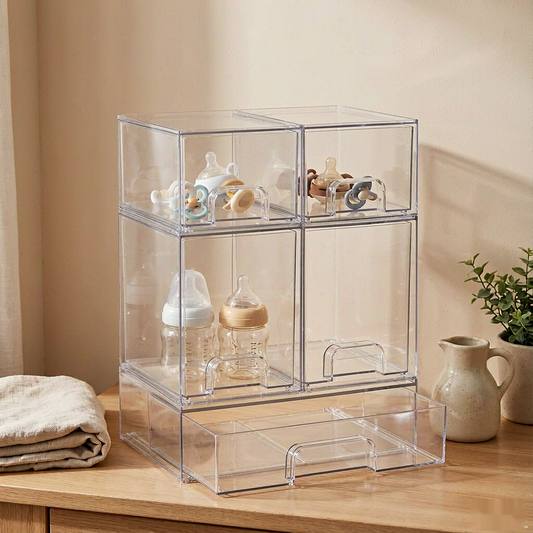 Stackable drawer organizer set of 5 on an oak countertop with baby bottles and pacifiers inside