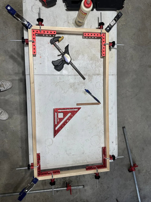 Customer photo - four clamps squaring a large picture frame
